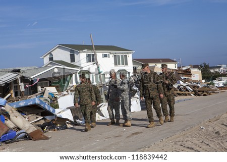NEW YORK -NOV 12: US Army helping Hurricane Sandy victims move a debris and parts of destroyed houses in the Breezy Point on November 12, 2012 in the Queens,  NY