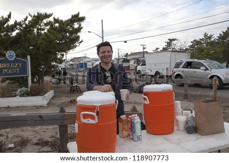 NEW YORK - NOV 12: Volunteers and workers helping people after Hurricane Sandy in  the flooded neighborhood at Breezy Point in Far Rockaway area  on November 12, 2012 in New York City, NY