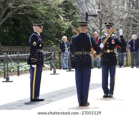 WASHINGTON - March 3: People watch as members of the Honor Guard change at the Tomb of the Unknown Soldier in Arlington National Cemetery on March 3, 2009 in Washington, DC.