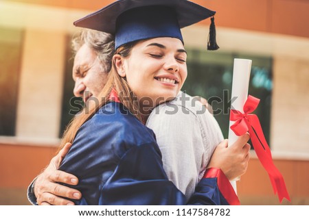 Graduated student hugging her father