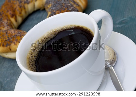 Cup of coffee with bagel