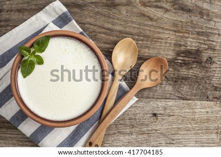 Homemade yogurt on wooden table