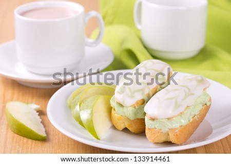 Mini eclairs with the cream with tea match.