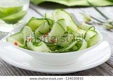 Salad of cucumber, sesame seeds and pepper.