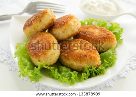 Chicken cutlets with salad.