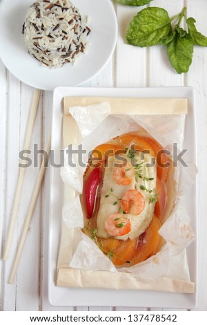 Baked in parchment fish with shrimp and peaches.