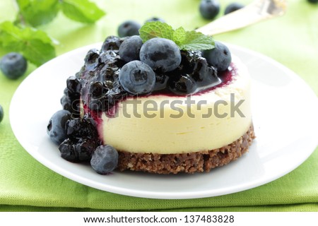 Mini-cheesecake and chocolate biscuits and bilberry.