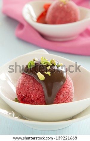Strawberry sorbet with chocolate and pistachios.