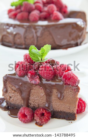 Chocolate cheesecake with raspberries.
