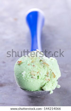 Ball pistachio ice cream spoon.
