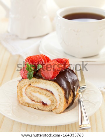 Chocolate swiss roll cake with strawberries