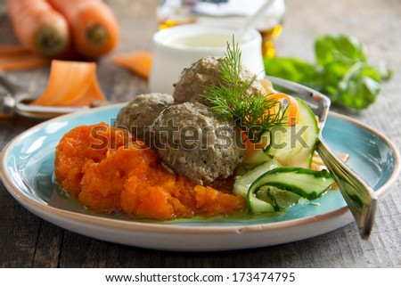Meat dumplings with carrot puree and salad for dietary and baby food.