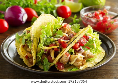 Tacos with pork and tomato salsa.
