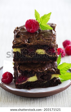 Chocolate brownie with raspberries and mascarpone.
