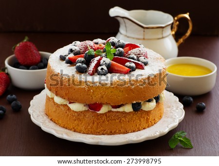 Genoise (cake) with cream, berries and lemon cream.