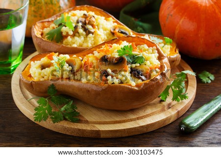Pumpkin stuffed with couscous with grilled mushrooms.