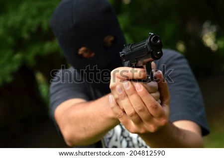 Burglar with 9mm pistol