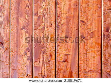 Abstract raindrops pattern on wooden board. Background.