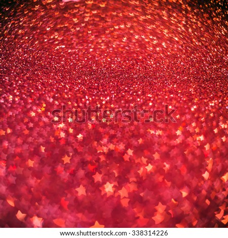 Festive Christmas background with stars. Abstract twinkled bright background with bokeh defocused lights