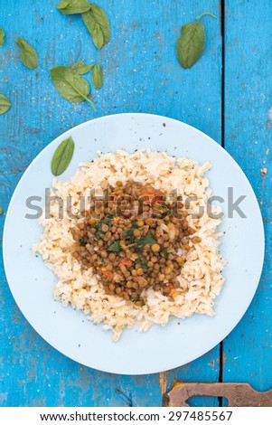 Vegan dish with brown rice, lentil and spinach