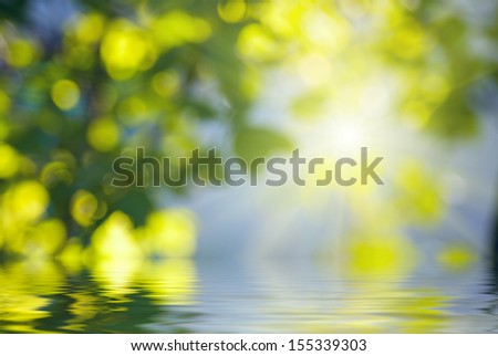 Natural background with rays of light, reflected in water
