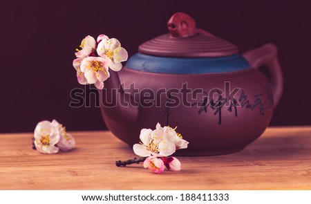 Ceramic teapot for a tea ceremony with sakura flowers
