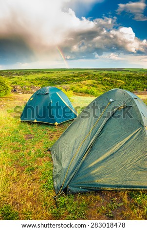 Wet camping tents after the rain in a valley of Ukrainian National park
