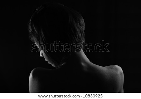 Woman\'s Head and Shoulders against a Black Background