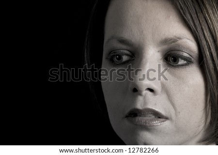 Shot of an Attractive Brunette Looking Pensively Off Camera