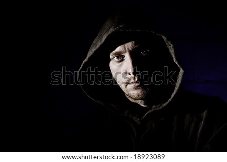 Hooded Male against Dark Grunge Background