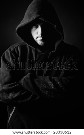 Shot of a Hooded Youth against Dark Background