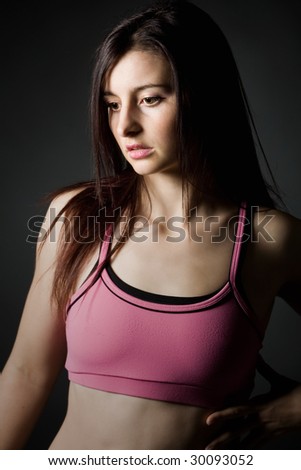 Shot of a Sporty Girl in Pink Top Looking off Camera
