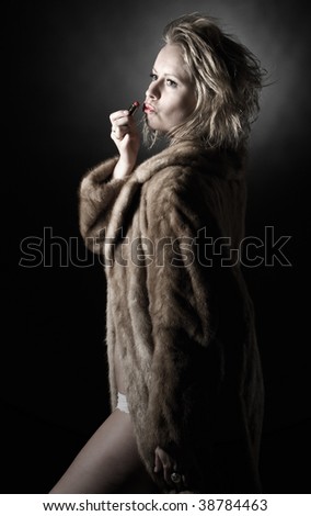 Low Key Shot of Vintage Styled Woman in Fur Coat