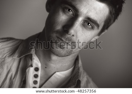 Striking Portrait Shot of a Handsome Dark Haired Male with Goatee Beard