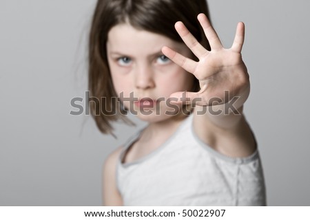 Powerful Shot of a Child with her Hand Up