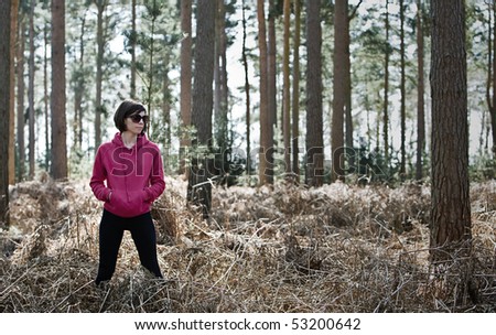 Shot of a Woman in Running Gear in the Forest