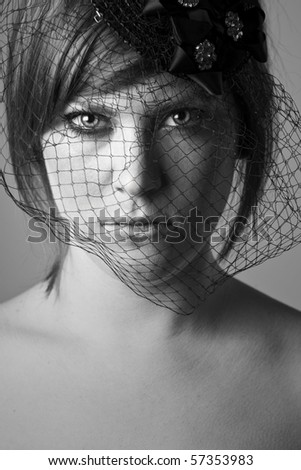 Powerful Black and White Shot of a Sinister Looking Woman with Veil