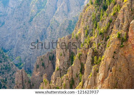 Tomichi Point overlook of Black Canyon of the Gunnison showing jagged cliffs and canyon layers