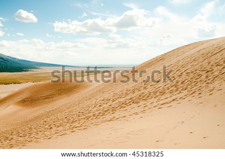 great sand dunes and footsteps in sand