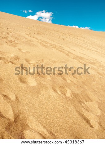 great sand dunes and footsteps in sand