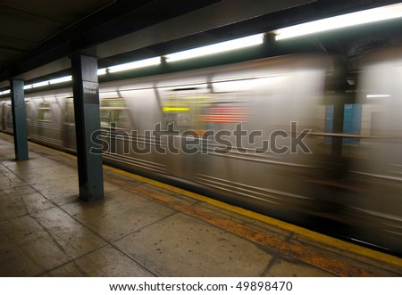 subway car flying by with an American Flag