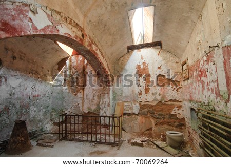 deteriorated prison cell walls