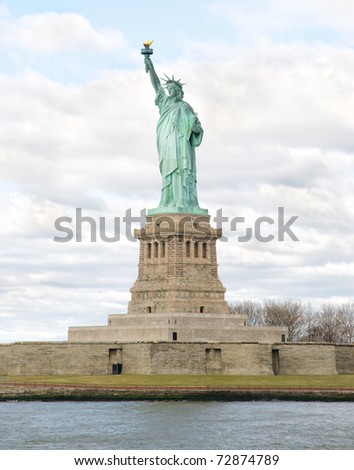 Statue of Liberty, Liberty Island and pedestal with clouds