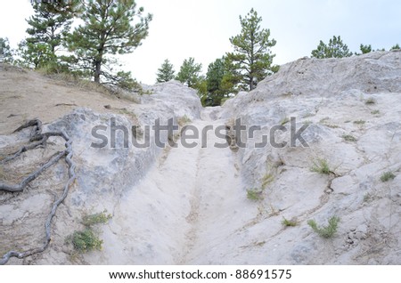Oregon Trail, covered wagon ruts in white sandstone