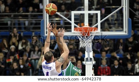 MINSK, BELARUS - OCTOBER 19: Player of  BC Minsk-2006 with a ball attacks a ring of BC Honka in VTB United League game on October 19, 2010 in Minsk, Belarus