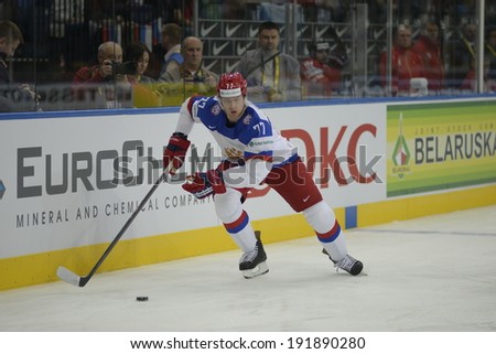 MINSK, BELARUS - MAY 9: Belov Anton of Russia skates up the ice during the IIHF World Championship match between Russia and Switzerland at Minsk Arena on May 9, 2014 in Minsk, Belarus.