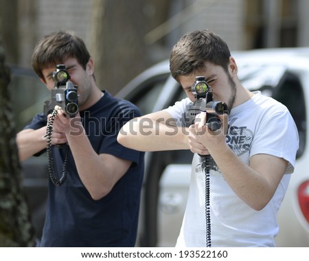 ZASLAWYE, BELARUS - MAY 17: Players with guns on during Laser Tag IT-CUP tournament at abandoned summer camp on May 17, 2014 in Zaslawye, Belarus.