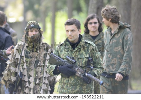 ZASLAWYE, BELARUS - MAY 17: Players with gun during Laser Tag IT-CUP tournament at abandoned summer camp on May 17, 2014 in Zaslawye, Belarus.