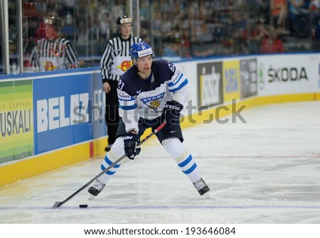 MINSK, BELARUS - MAY 19: PAKARINEN Iiro (81) of Finland shoot the puck during 2014 IIHF World Ice Hockey Championship match at Minsk Arena on May 19, 2014 in Minsk, Belarus.