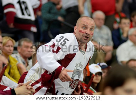 MINSK, BELARUS - MAY 19: Fans of Latvia looks on during 2014 IIHF World Ice Hockey Championship match on May 19, 2014 in Minsk, Belarus.